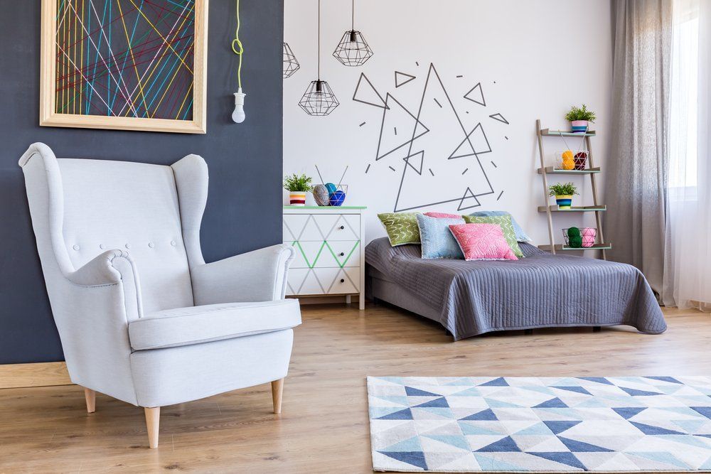 There Is A Chair And A Bed In The Room — Allwood Upholstery In Manunda, QLD