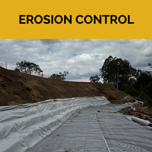 Geotextile matting has been installed along the surface and edge of a river bank.