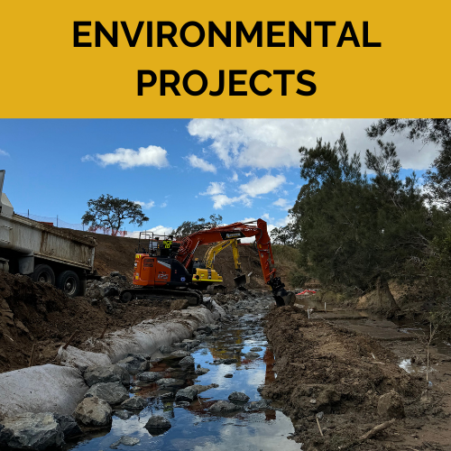Two spencer civil & earthworks excavators working in a muddy river bank.