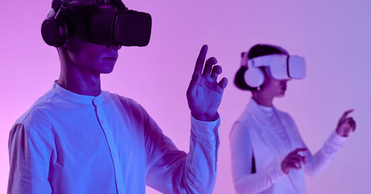 A man and a woman are wearing virtual reality headsets.