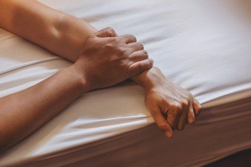 Man's Hand Holding A Woman Hand — Placentia, CA — Law Offices of Kennith L. Peterson