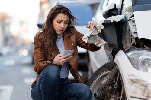 Woman On Car Accident — Placentia, CA — Law Offices of Kennith L. Peterson