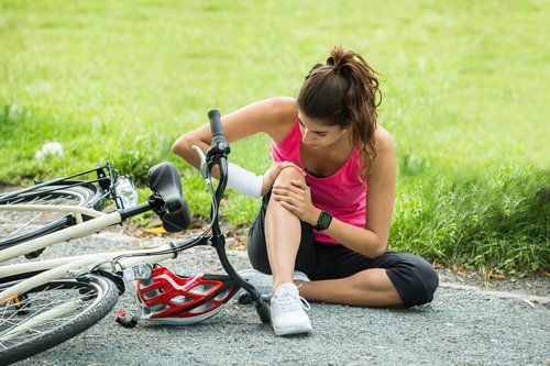 Woman On Bike Accident — Placentia, CA — Law Offices of Kennith L. Peterson