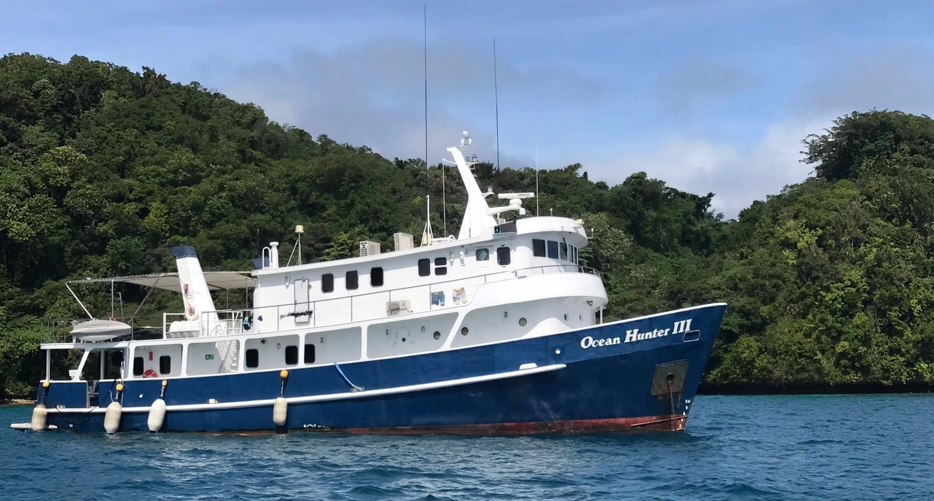 Blue and white boat named