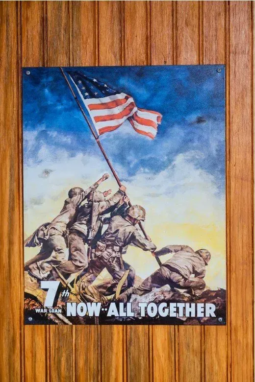 Marines raising the American flag on Iwo Jima. Patriotic poster, blue sky, brown uniforms, and a flag. “Now All Together.”