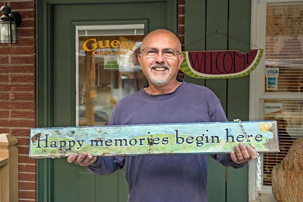 Frank holding signage