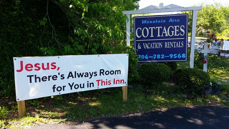 Mountain Aire Cottages, Inn & Glamping signage.