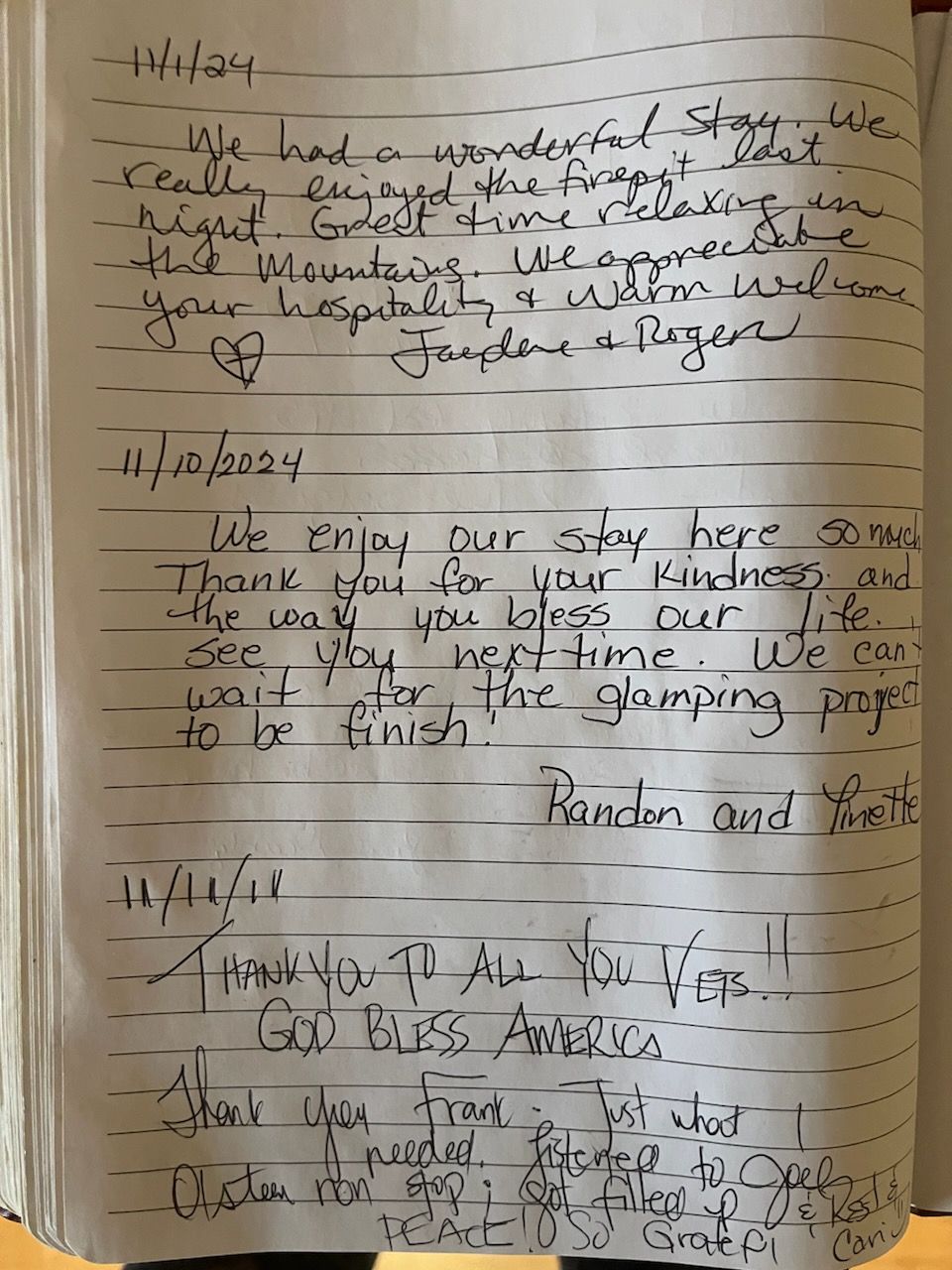 Handwritten notes in a guest book, including dates and positive comments about the stay.