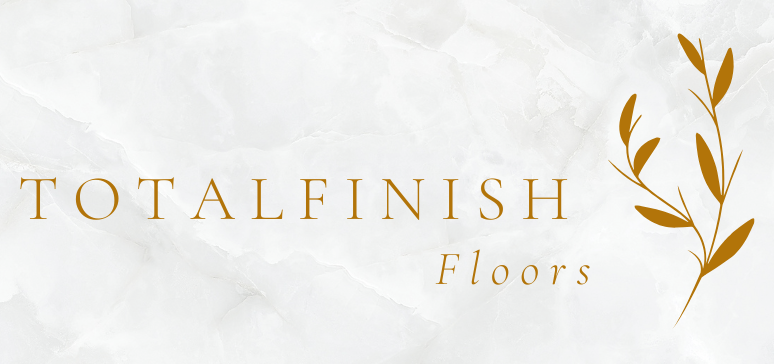 Logo for Totalfinish Floors. Gold text on a marbled white background. Includes an illustration of leafy sprig.