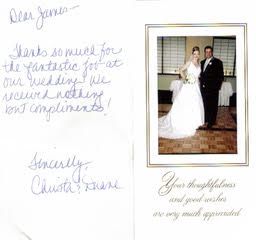 A bride and groom are standing next to each other on a wedding card.