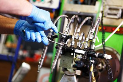 Diesel Services — Professional Mechanic Testing Diesel Injector in Pleasant Grove, UT