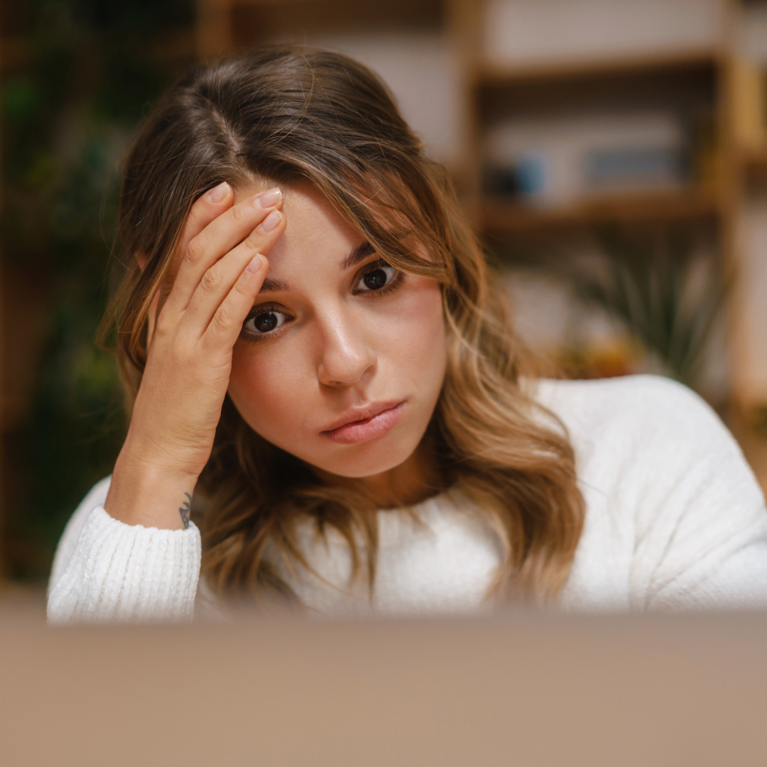 stressed woman who just lost her health insurance plan