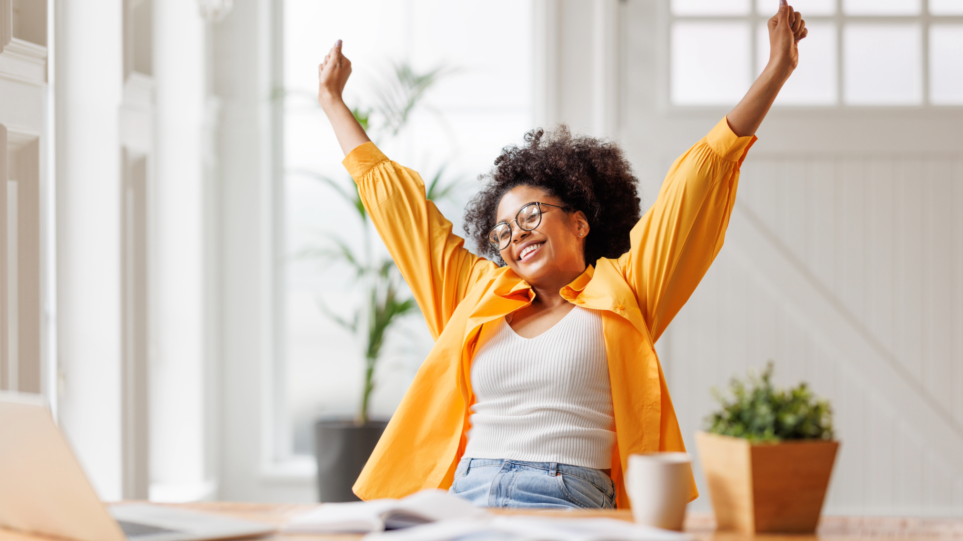 lady with arms up and smiling