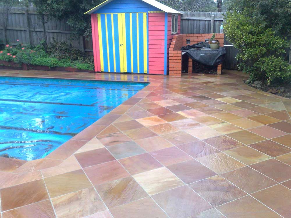warm tiles surrounding pool