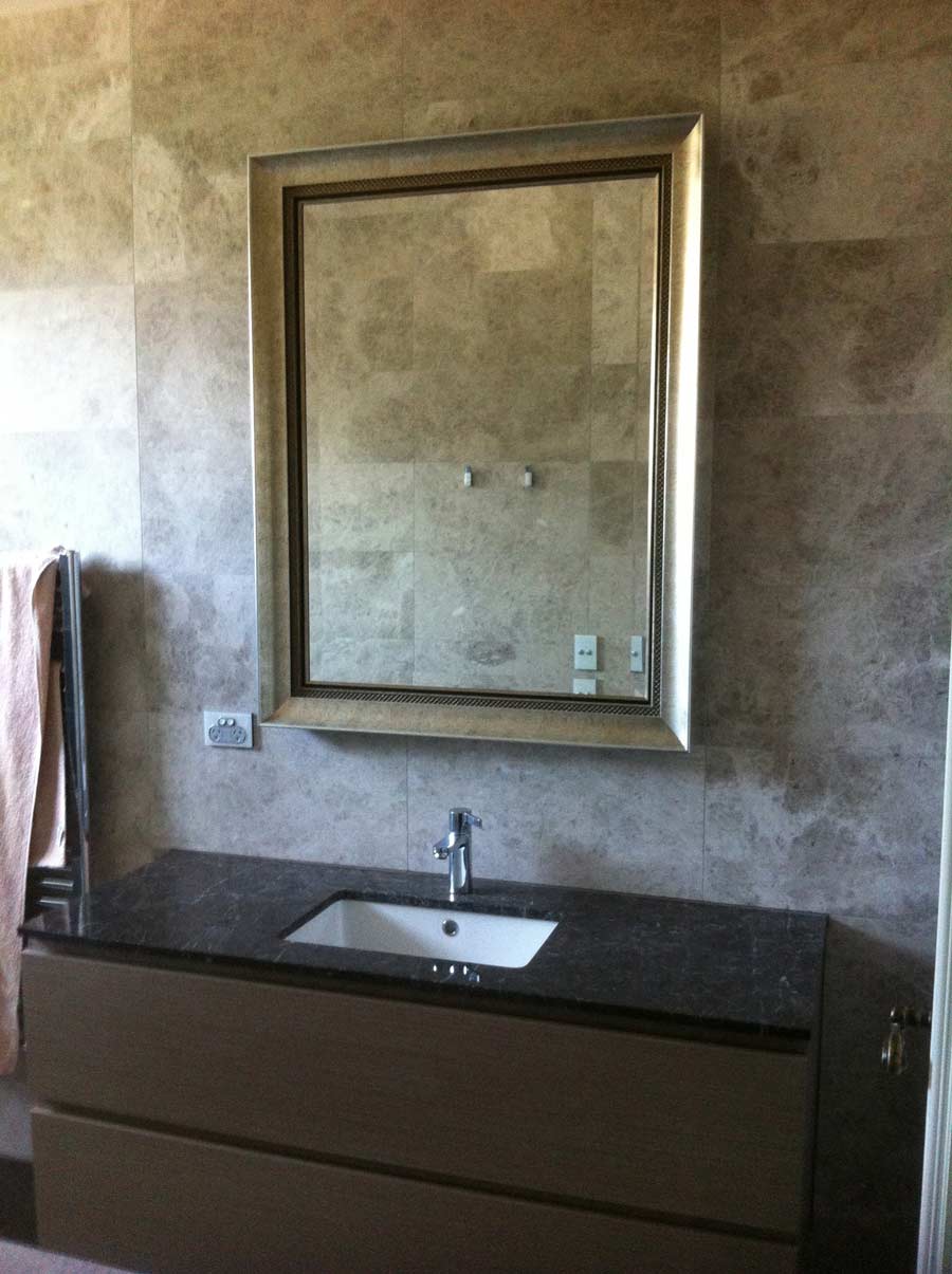 tile surrounding bathroom mirror
