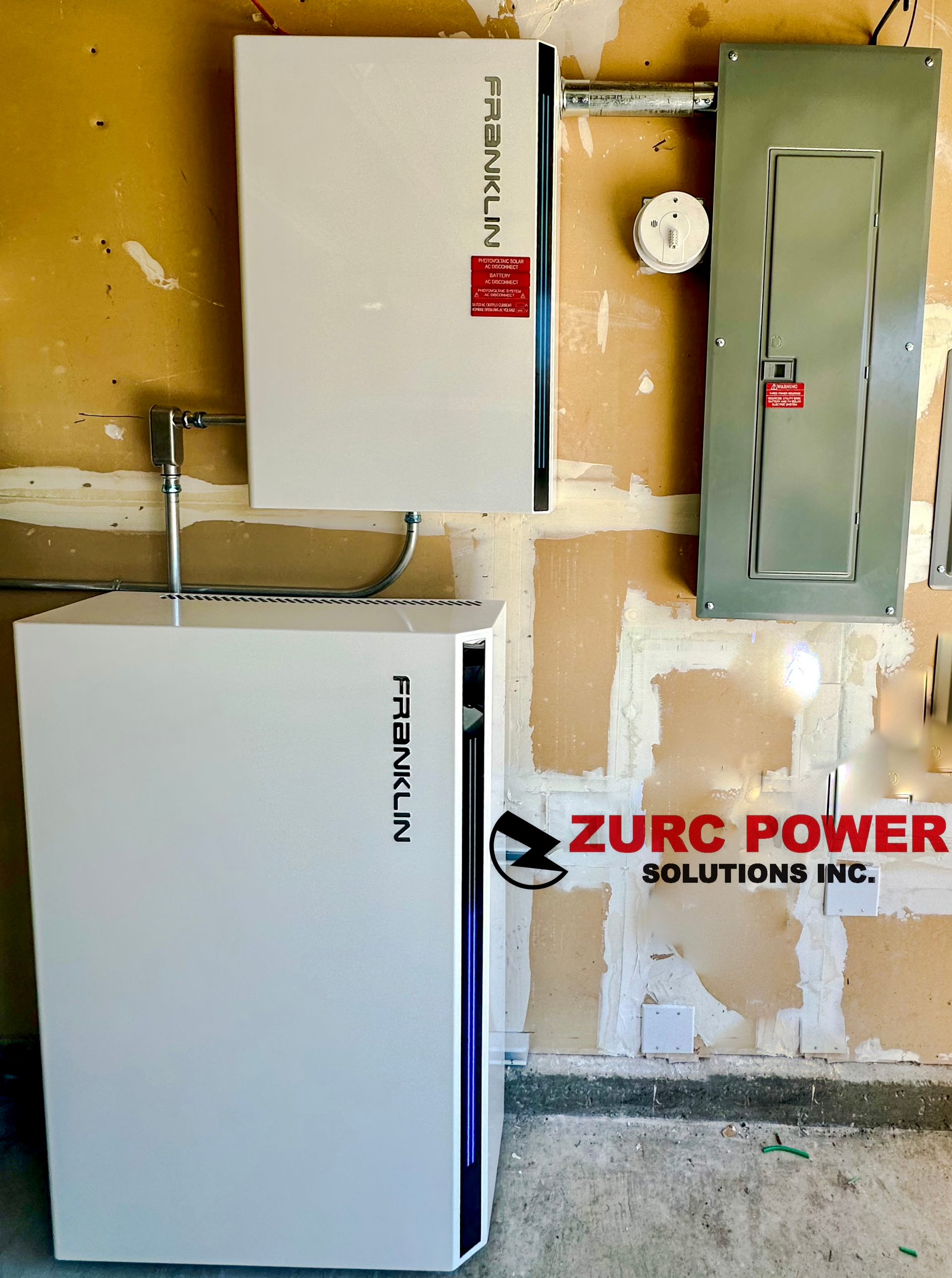 Two white boxes are sitting next to each other on a wall.