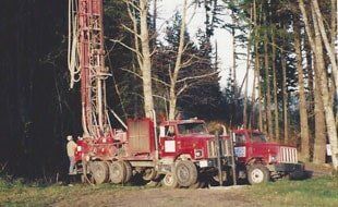 Well Drilling — Drilling Trucks In A Forest in Bow,WA