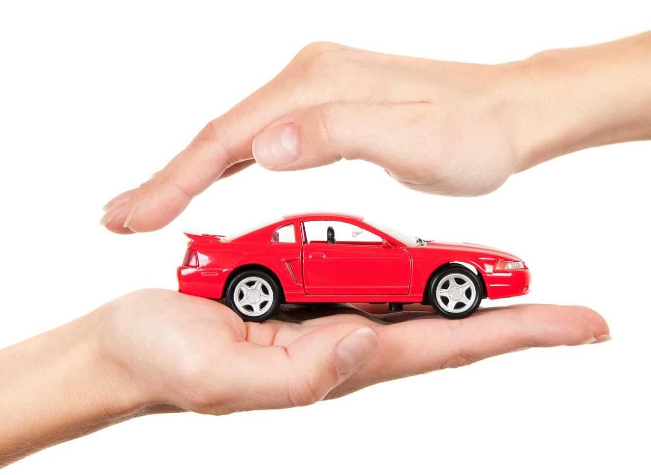 Auto Insurance — Toy Car on Two Hands in Largo, FL