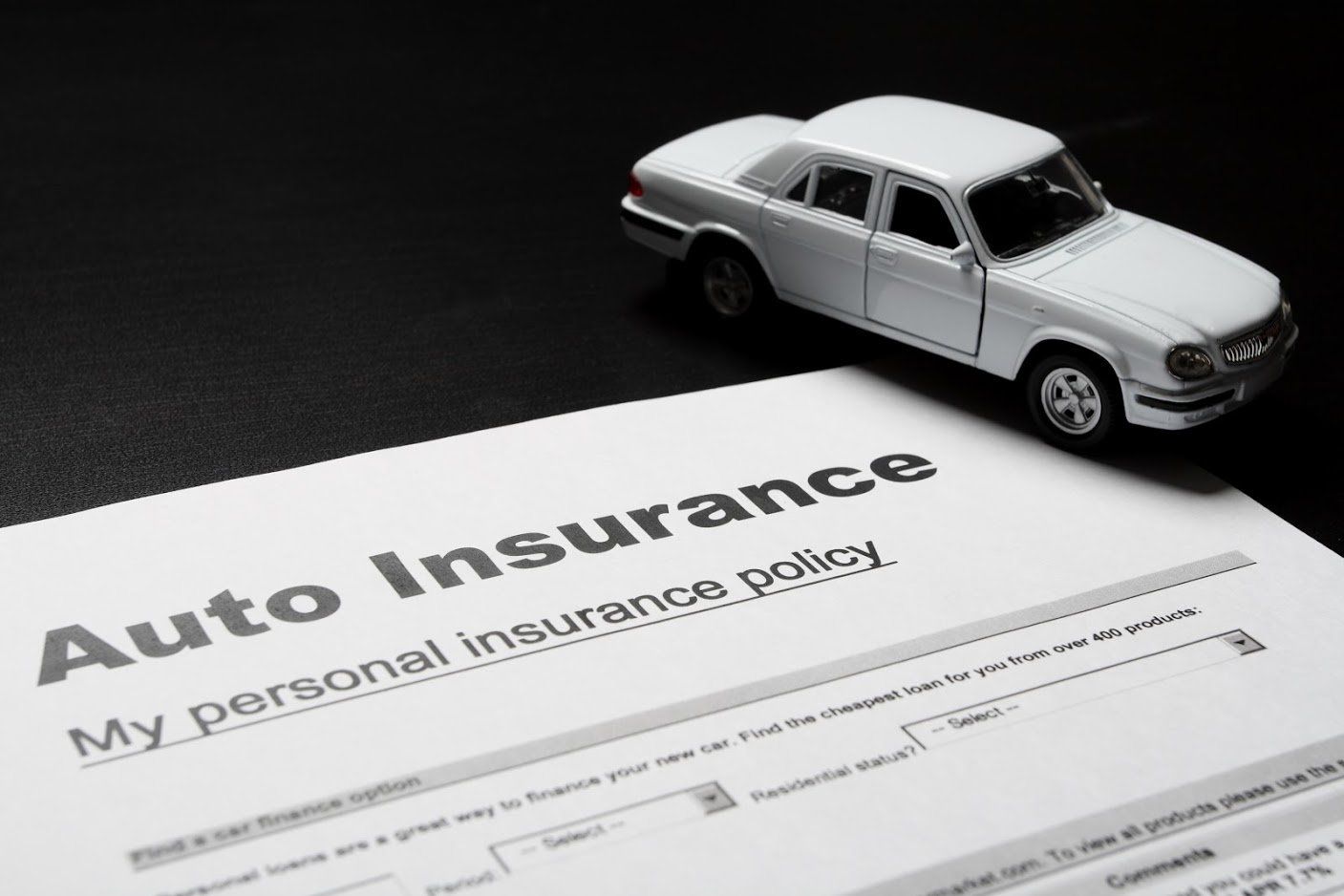 Auto Insurance — Insurance Paper With Miniature Car in Largo, FL
