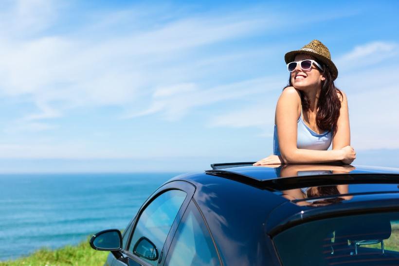 Warm Weather Driving — Woman Enjoying The Warm Weather in Largo, FL