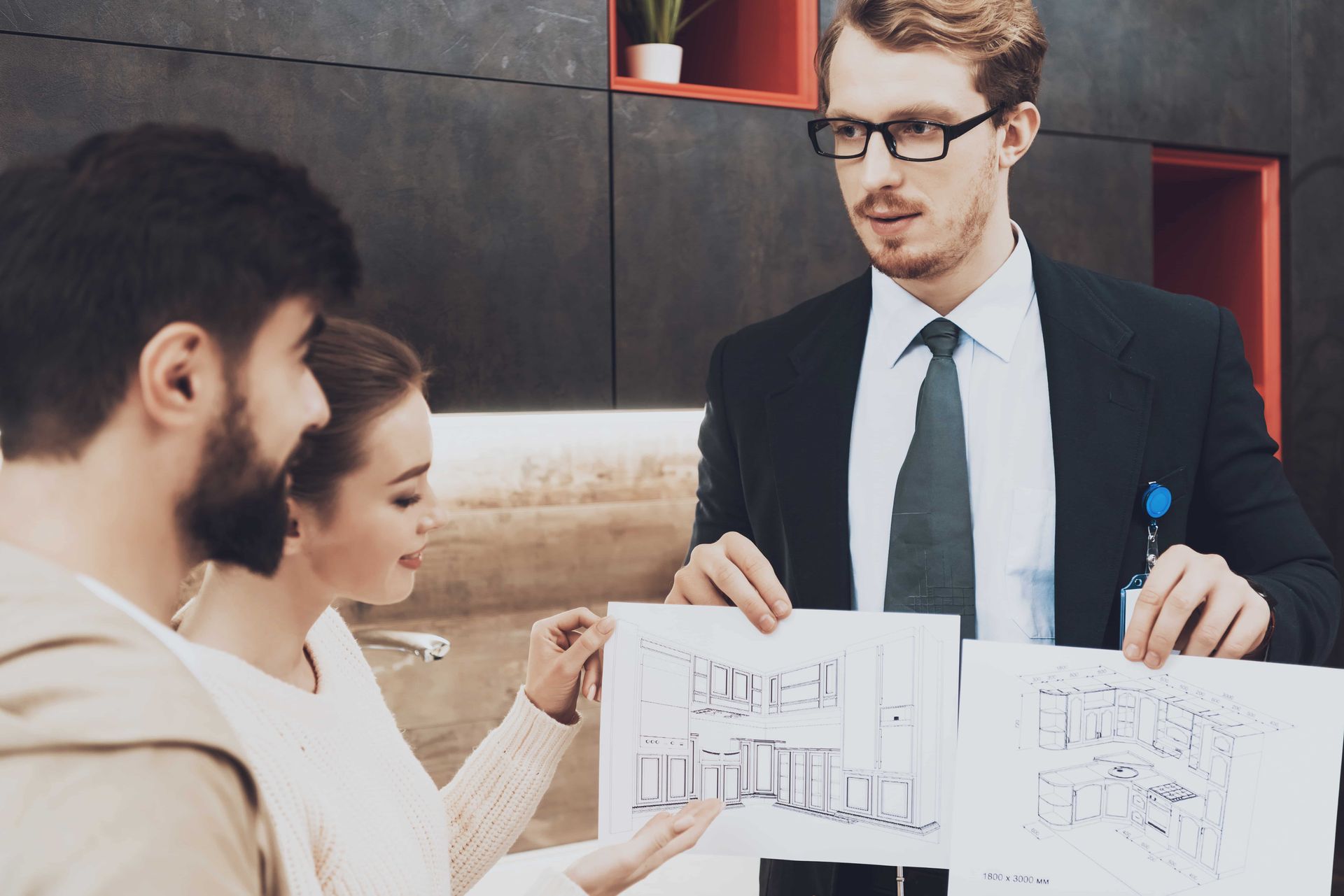 Man holding a black and white drawing of a custom design