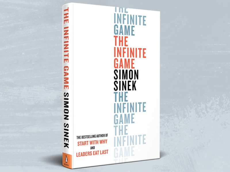 A book titled the infinite game by simon sinek