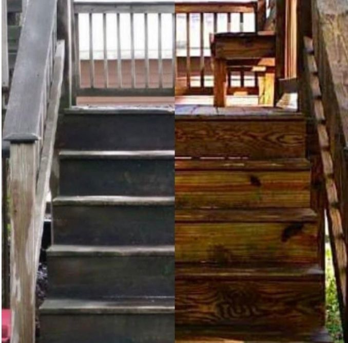 Wooden outdoor stairs, half weathered gray, half stained brown.