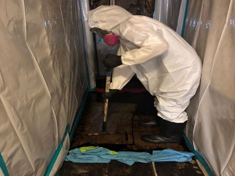 Certified technician removing asbestos