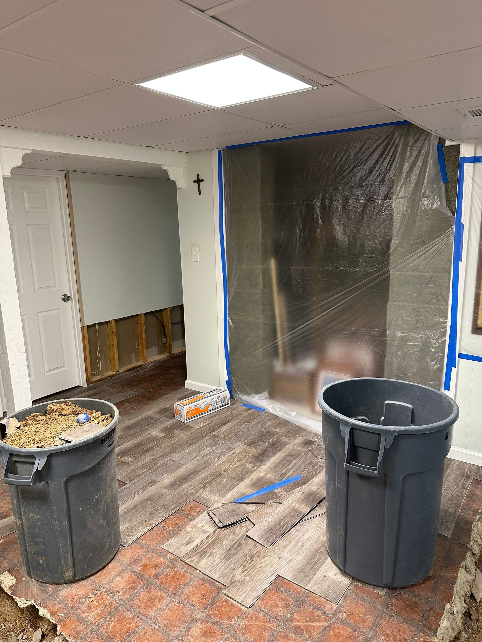 Containment barrier setup during basement water damage restoration