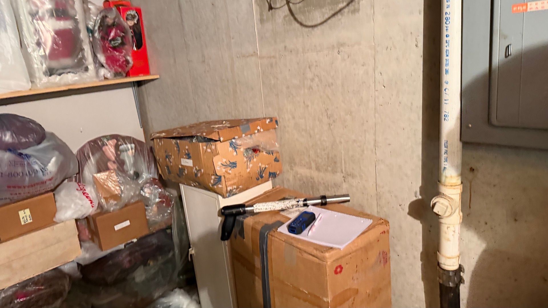 Technician inspecting moisture levels in a water-damaged basement in Saint Charles MO