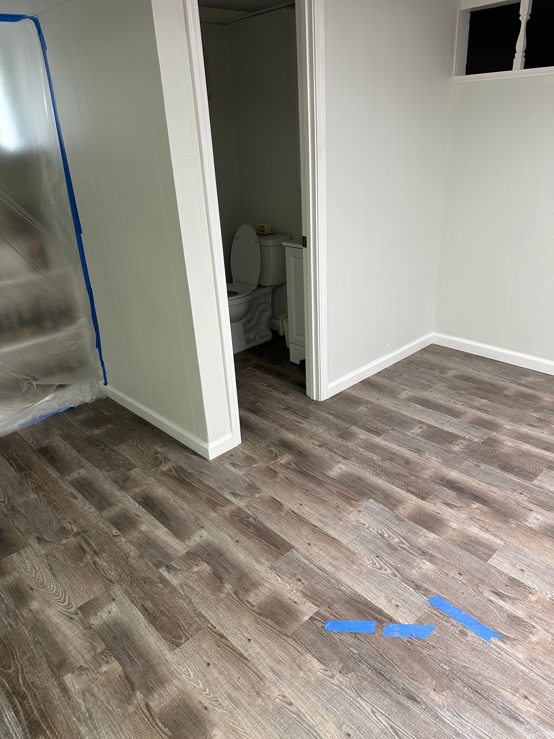 New flooring installation during basement restoration