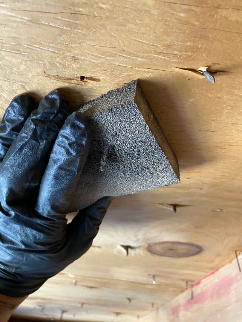 Dry sponge cleaning technique being used on wood surfaces during fire restoration in St. Louis