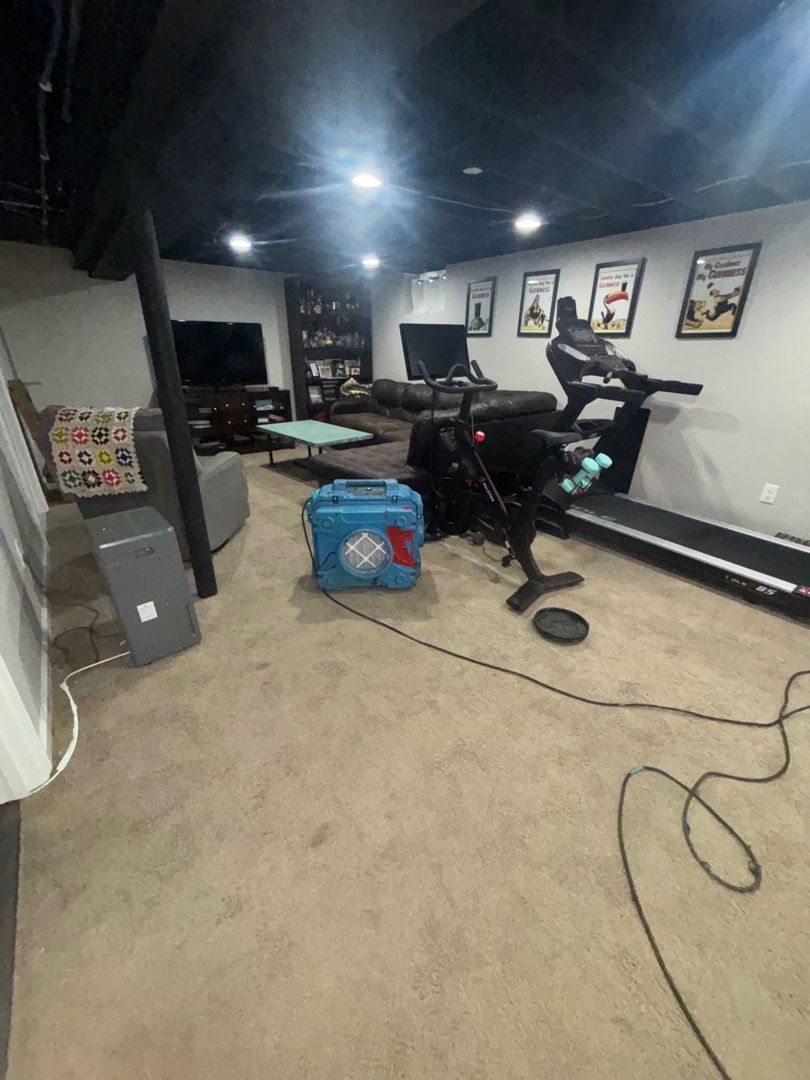 Finished basement with air scrubber and fans running