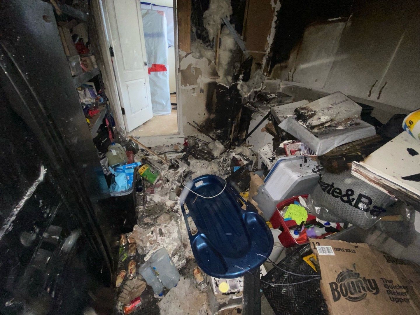 Interior room with visible smoke and soot damage on walls and ceiling in a St. Louis home