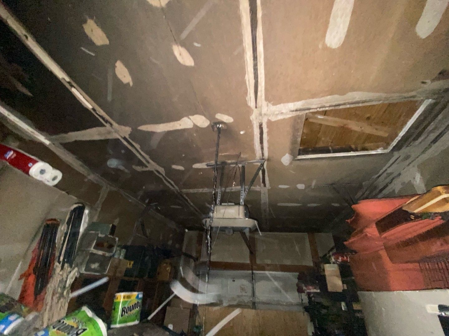 Garage ceiling covered in heavy soot and smoke residue from fire damage in St. Louis