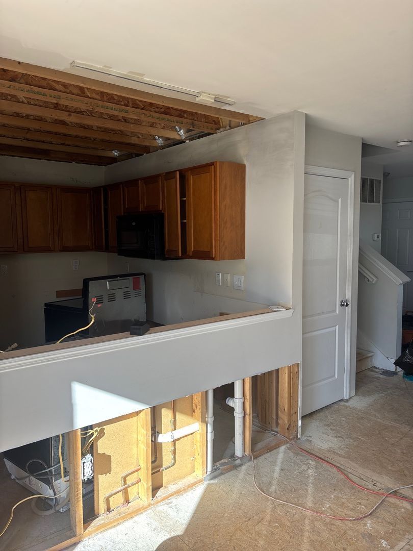 Kitchen area showing selective demolition after fire damage in a St. Louis residential home