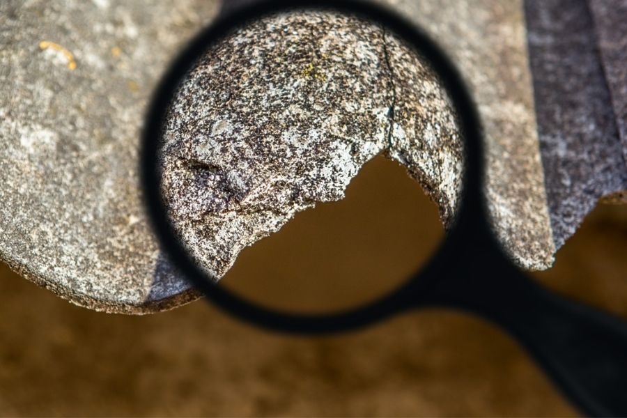 Inspector conducting asbestos assessment