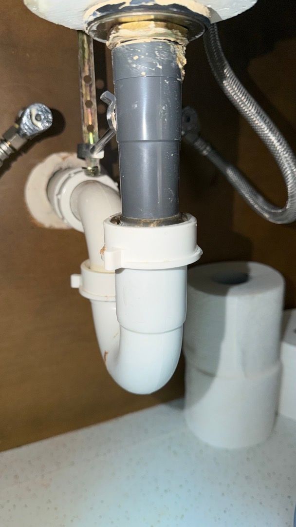 Loose P-trap connection identified as the source of bathroom sink water leak