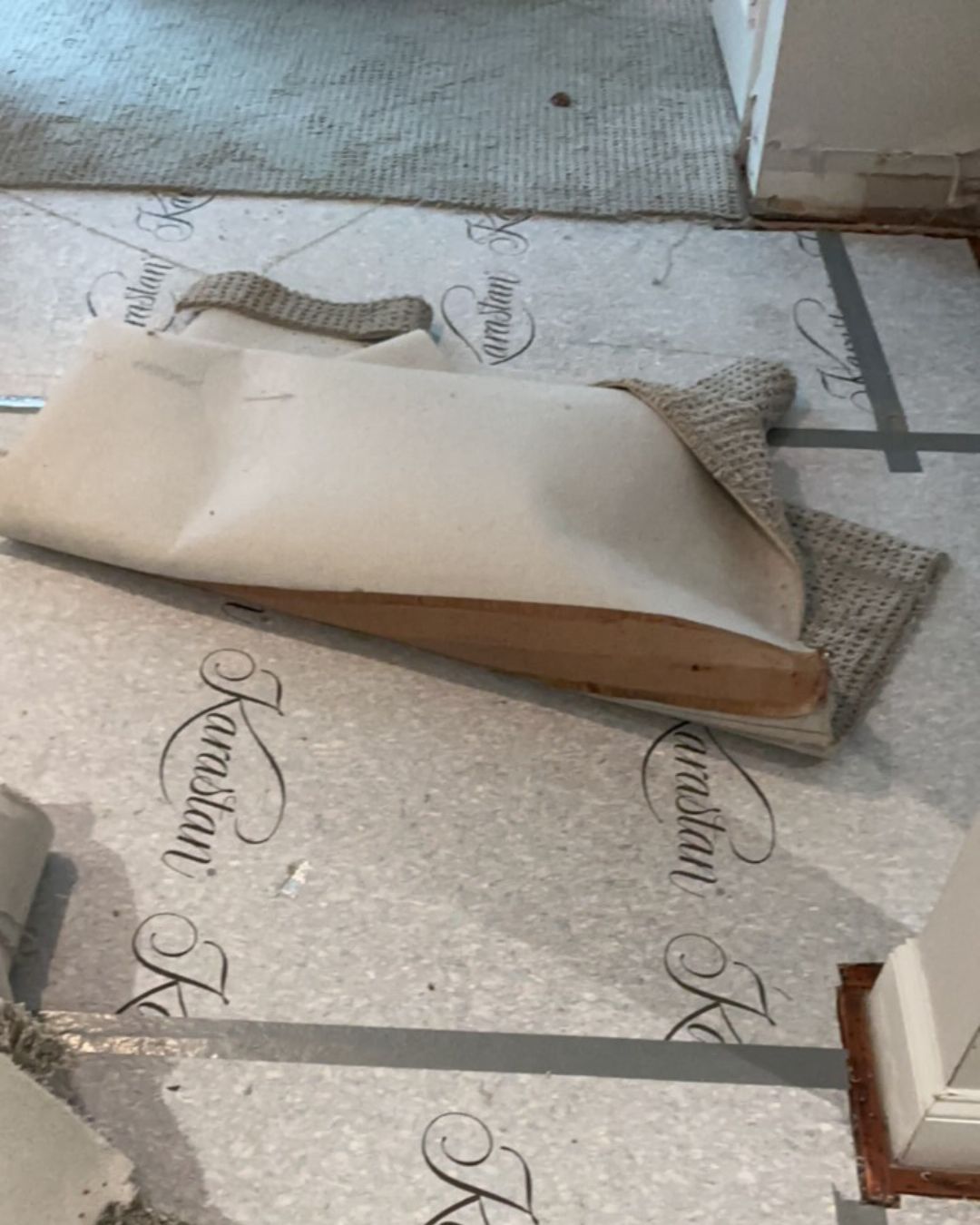 Subfloor exposed after carpet and padding removal