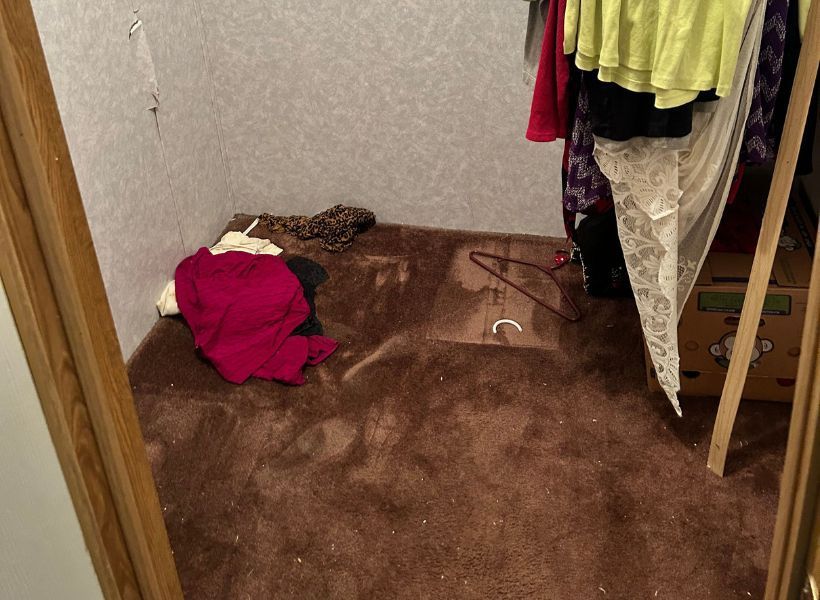 water-damaged carpet in the bedroom closet