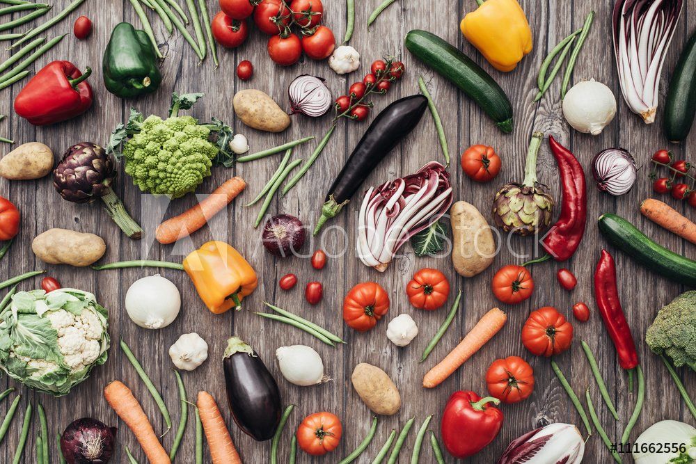 There are many different types of vegetables on the table.