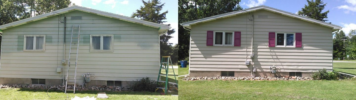 Two beige houses side by side, one with pink shutters, in a grassy yard.