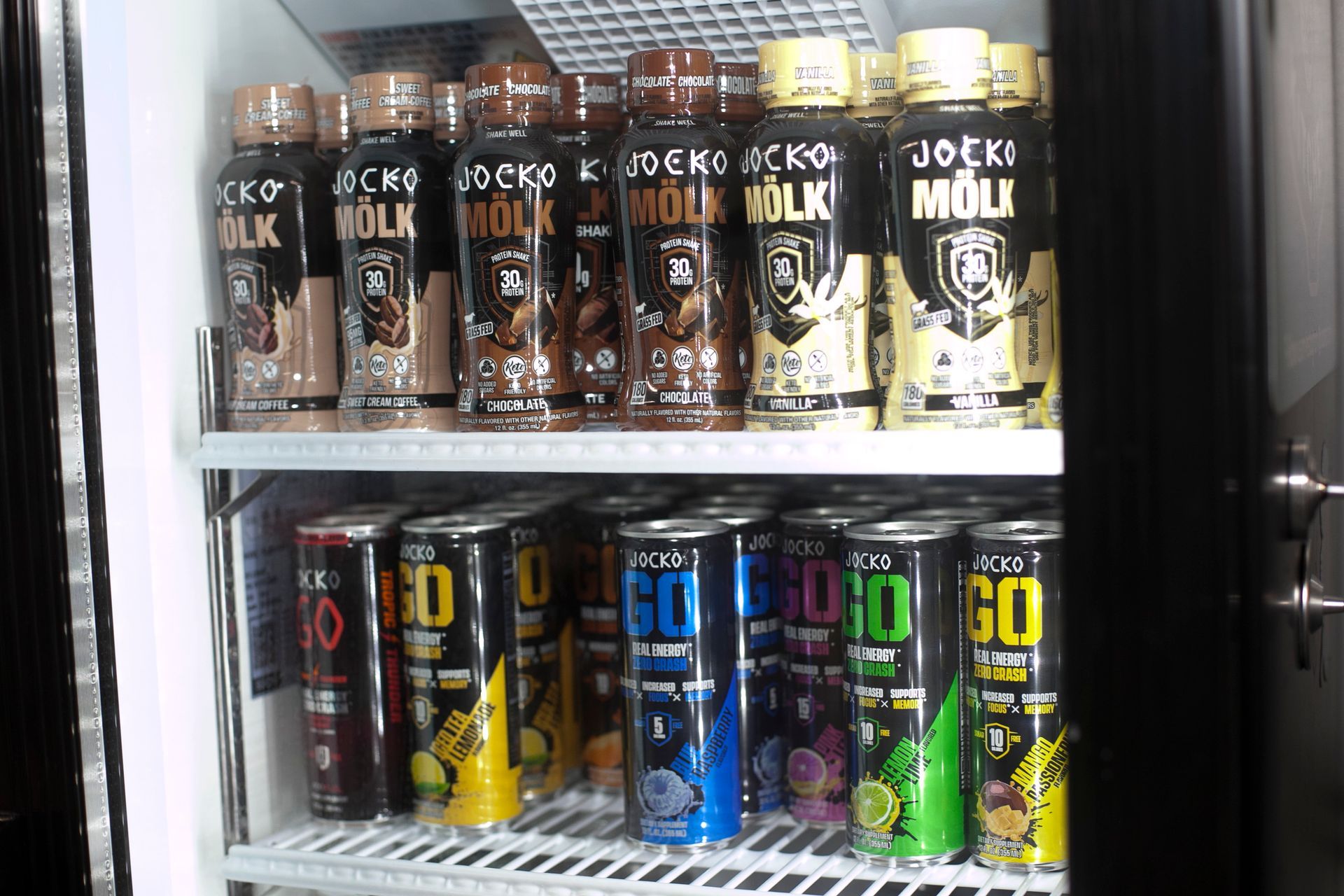 Refrigerator stocked with Joekr Molk and Go energy drinks.