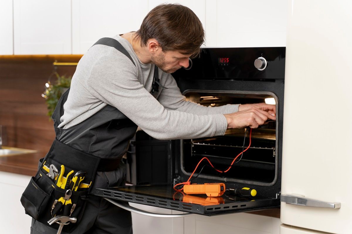 LG Appliance repair Carlsbad CA technician fixing home appliance
