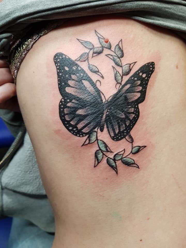 vlinder tattoo black and grey colour