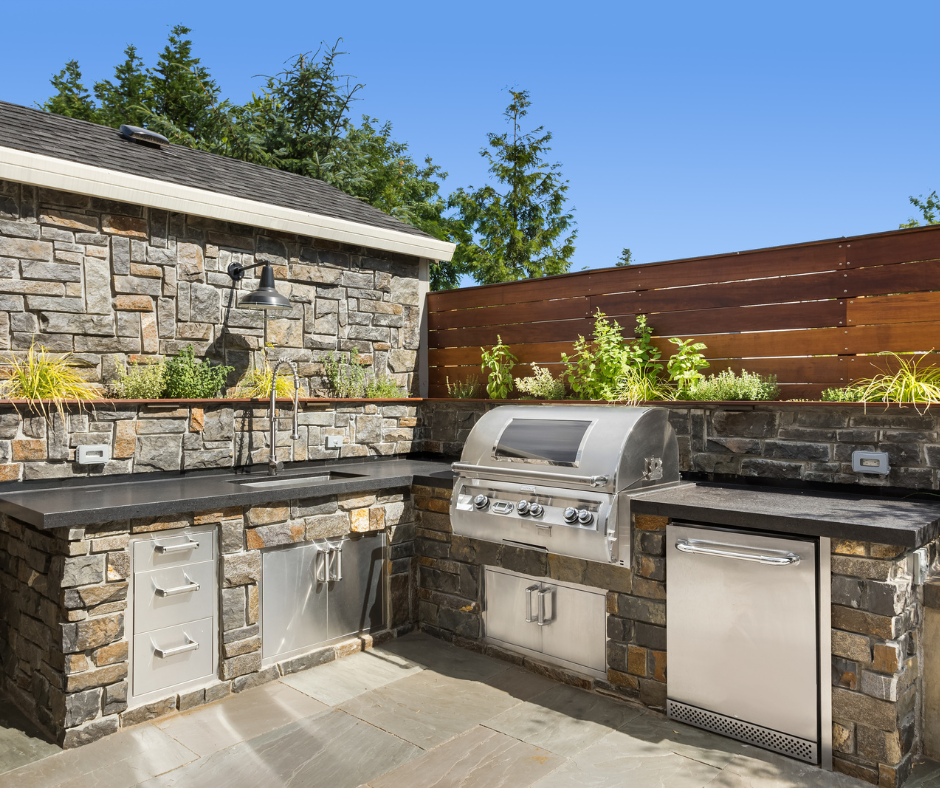 An outdoor kitchen on the patio of a Vermont home