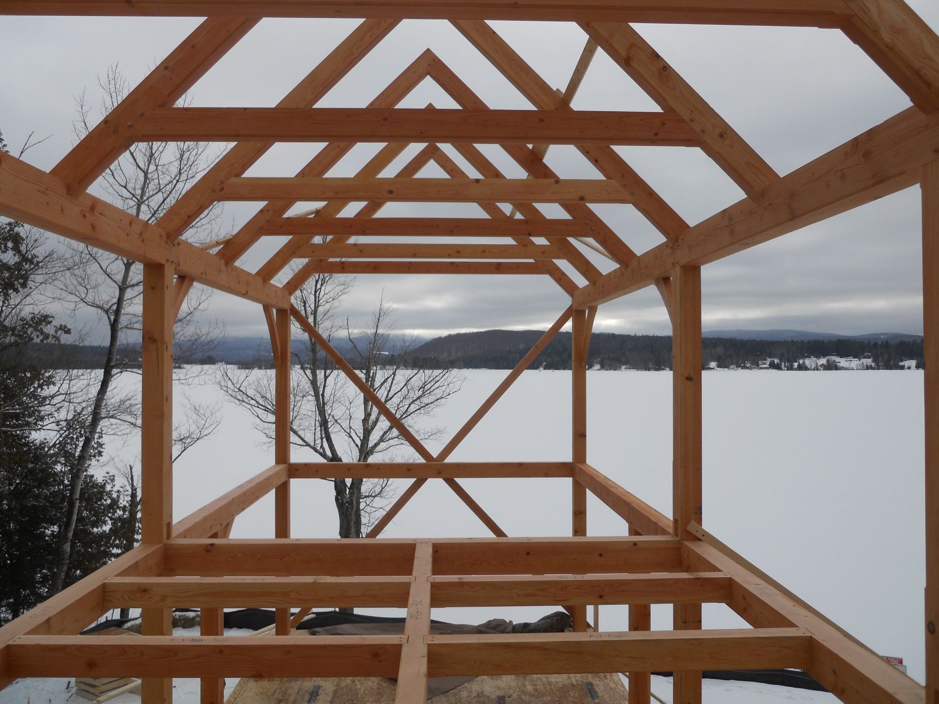 A wooden structure is being built in the snow
