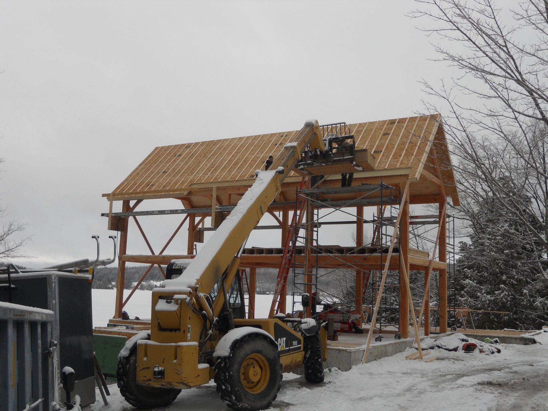A yellow forklift with the word cat on it