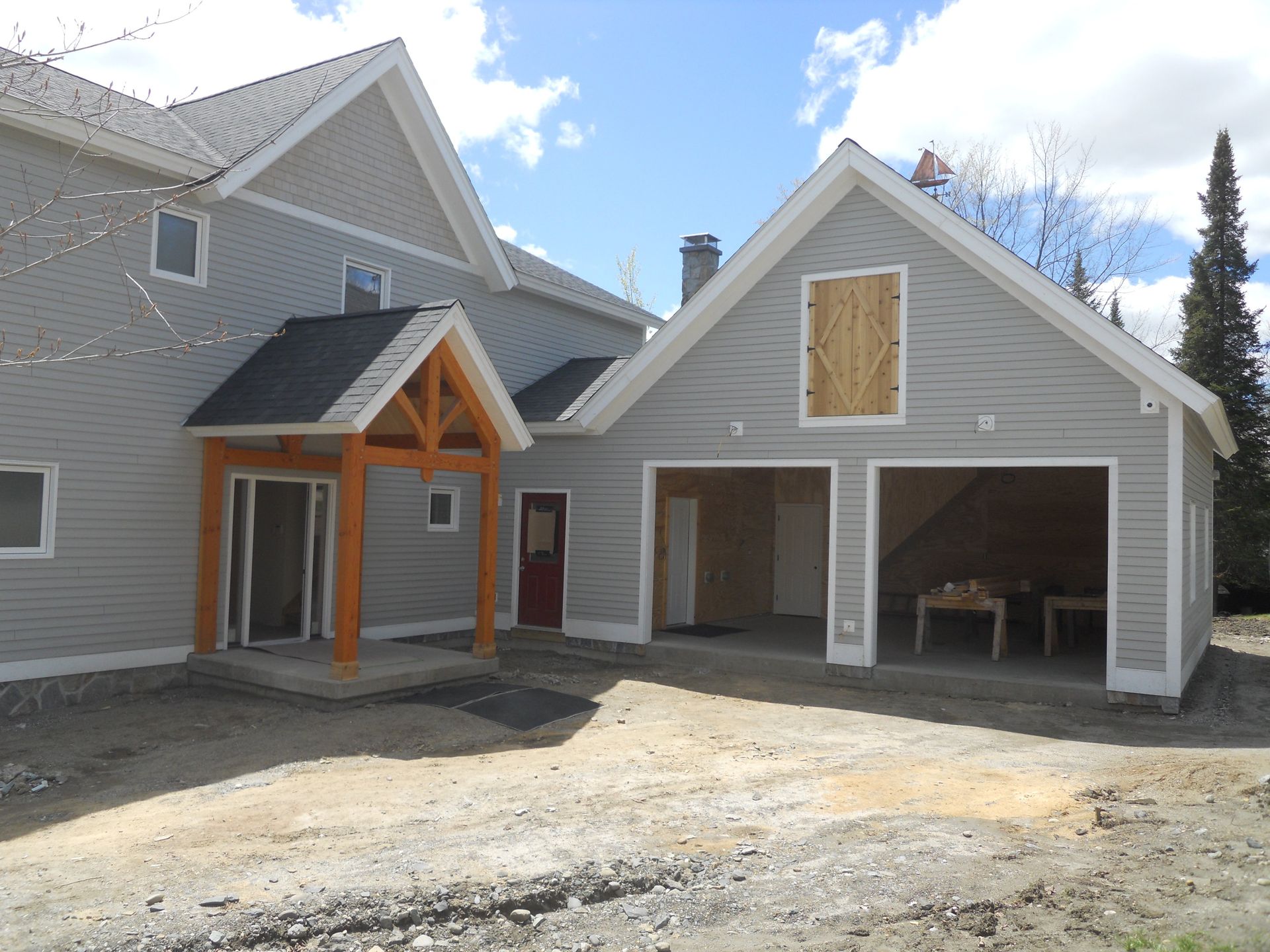 A large house with a garage underneath it