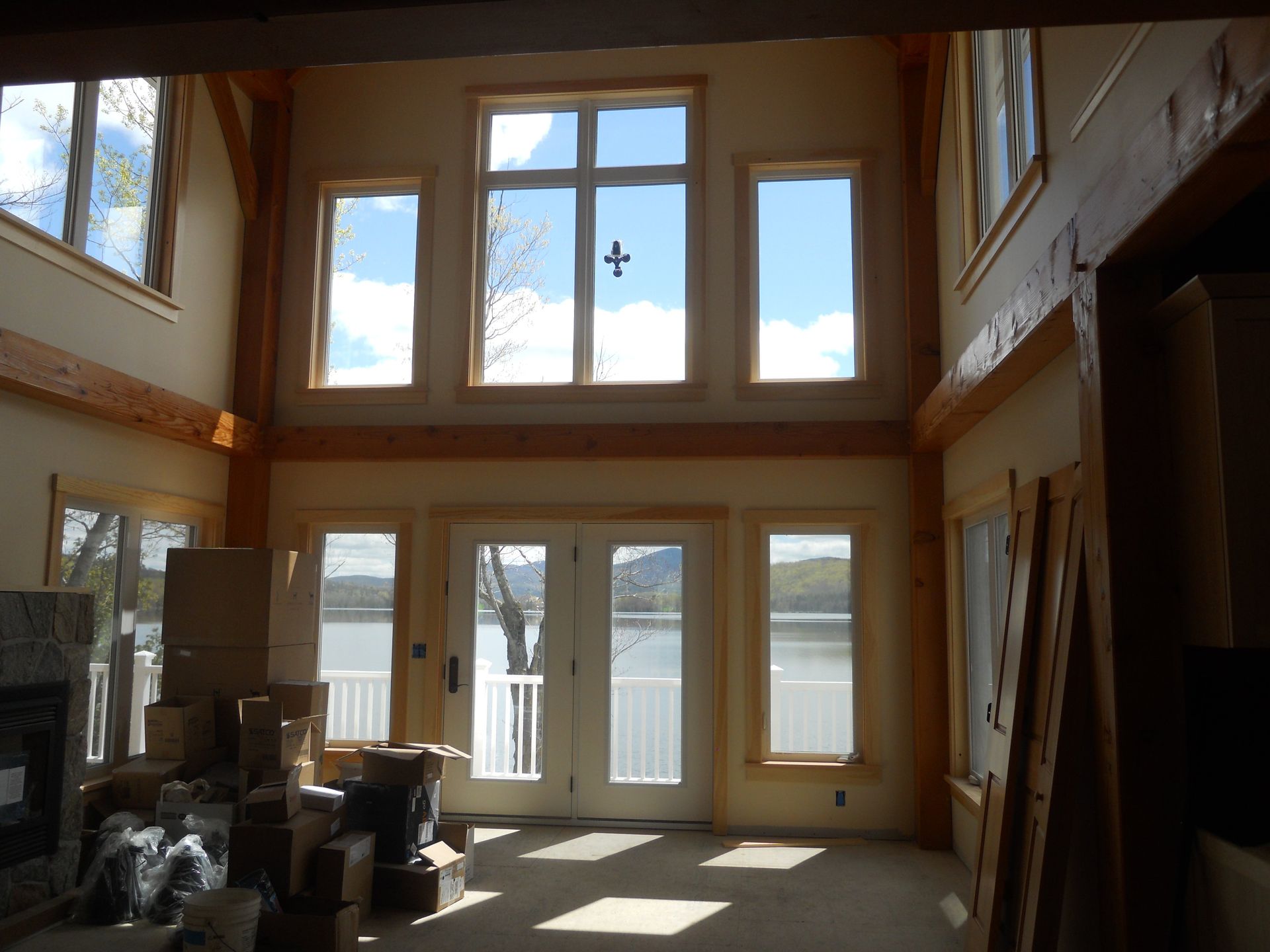 A large room with lots of windows and a cross on the ceiling